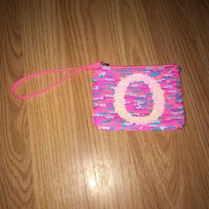 justice wallet with O initial and flip sequins